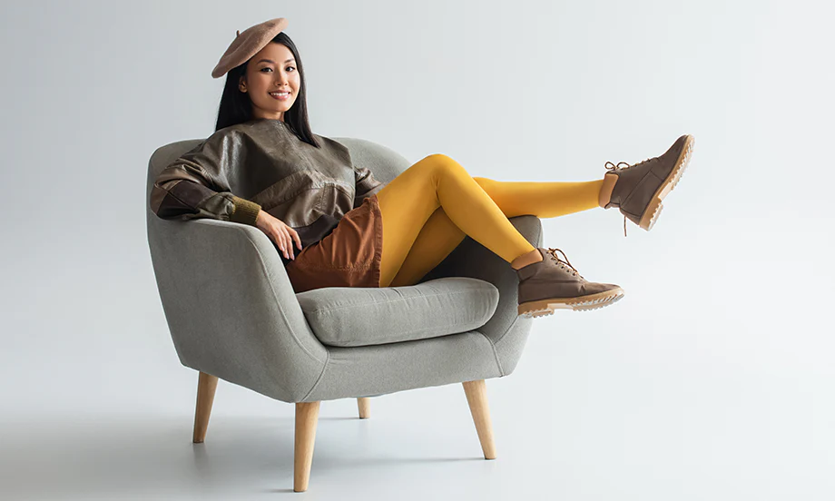 a girl wear hat with yellow pants